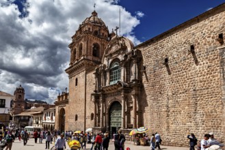 Church façade on a busy town square with moving shadows and dramatic skies, The churches of Cusco