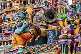A lively temple front with colorful sculptures and mythological representations, The Sri Pathrakali