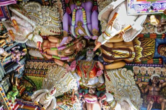 Detailed ceiling painting in a temple with bright colors and Hindu figures, The Sri Pathrakali