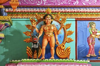 Temple sculpture with mythological scenes in bright colors and detailed depiction, The Sri