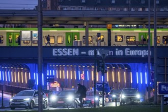The main train station in Essen, blue-lit underpass, bus station, am Europaplatz, public transport