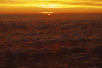 View from airplane window at sunrise