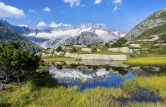 Picturesque mountain landscape, dammastock and damma glaciers reflected in Moorsee, Göscheneralp,