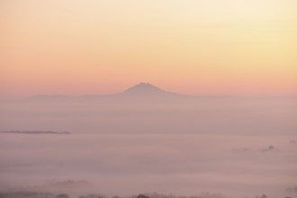 Hohenstaufen in the golden morning light, Aichelberg. Spectacular dawn over the foggy foothills of