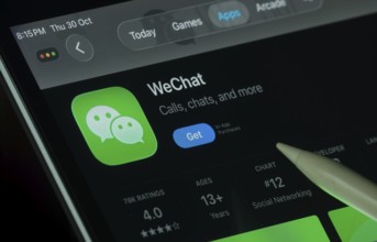 Dhaka, Bangladesh- 30 Oct 2025: WeChat app displayed on a iPad screen in dark mode with a digital