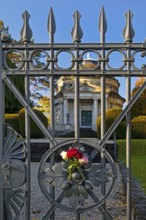 Roses at the fence door of the Carstanjen mausoleum in the Plittersdorf district, Bonn, North