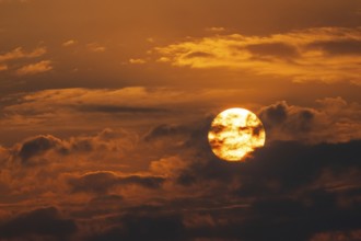 Dramatic sunset with clouds and sun, Etosha National Park, Namibia