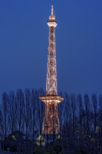 Red illuminated Berlin radio tower, half-timbered steel building by architect Heinrich Straumer,