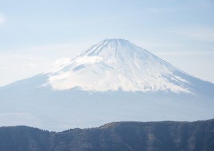 Snow-covered summit of Mount Fuji volcano in spring, Owakudani, Hakone, Japan