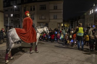 Martinszug in Essen-Rüttenscheid, the parish of St. Lambertus, Saint Martin actor on a horse, with