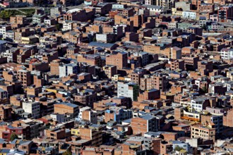 Narrowly built, dense city view with predominant brick buildings, the city of La Paz in Bolivia