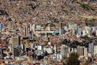 View of a dense urban landscape with many skyscrapers and mountains in the background, The city of