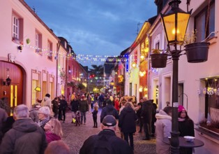 People in the Tiefstraße decorated for the Martin train in the evening, historic old town, Kempen,