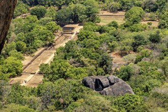 Aerial view of historic ruins and lush jungles with rock formations, the temples, dagobas, and