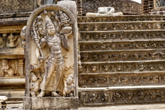 Ancient stone sculpture on decorated staircase, part of a historic ruin site, The temples of