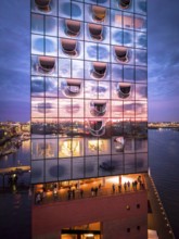Aerial view of the Elbe Philharmonic Hall with reflections on the façade in the evening light above