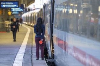 ICE train ready for departure, train staff waiting for the signal to continue, at Essen main