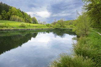 Landscape of a little lake on a cloudy day in spring, Upper Palatinate, Bavaria, Germany