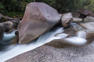 Turquoise blue water between rocks in the tropical rainforest of Babinda Boulders Queensland