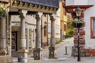 Half-timbered architecture along a quiet cobblestone street with lanterns, The old town of Arnstadt
