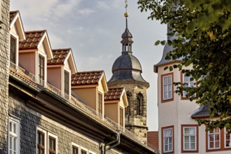 Church tower with traditional roofs and gables in an old town at sunset, The old town of Arnstadt