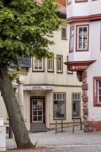 Summer day view of a historic street with distinctive facades and trees, The old town of Arnstadt