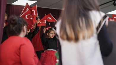 Children celebrate the 102nd anniversary of the Republic Day of Turkey, a national holiday