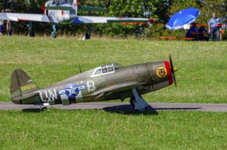 An RC model of a Republic P-47 Thunderbolt during a demonstration as part of an air show at the