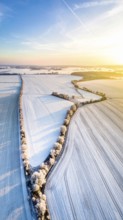 Bird Eye Perspective of Frost Covered Farmland. Seasonal Agricultural Scenery, winter and autumn