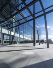 Modern architectural framework with glass and steel structure, glass facade with a greed of steel