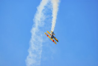 A Boeing-Stearman biplane during a flight demonstration as part of an air show at the Rossfeld in