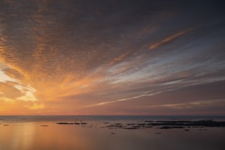 Offshore islands and skerries, sea, dramatically illuminated clouds, sunset, Otroya or Otrøya