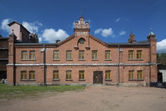 Brick façade with inscription Werla, former paper factory and mill for the production of groundwood