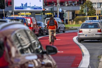 Cycle path, cycle lane, marked in red to draw the attention of motorists to the cycle path, between