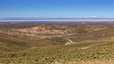 Vast desert landscape with hills and mountains in the distance, The landscape of the Altiplano in