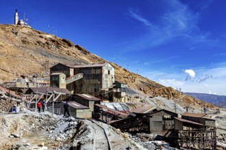 Old industrial plants in a rocky area under a clear blue sky, The silver mines of Potosi Bolivia