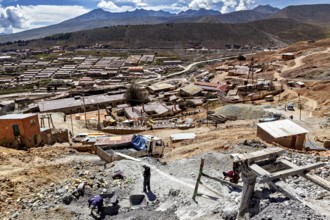 View of a mining area with scattered buildings in a dry, wide landscape, The silver mines of Potosi