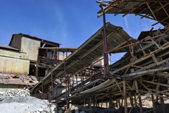 Old, dilapidated industrial structure under a clear blue sky, The silver mines of Potosi Bolivia