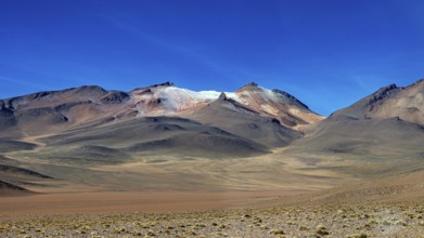 Rocky mountains under a deep blue sky in an arid region, The landscape with the volcanoes on the