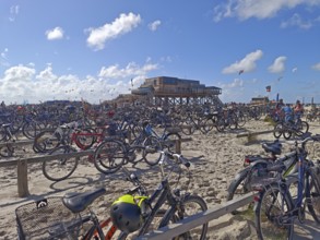Car park for bicycles on the North Sea beach, Pfahlbau Strandbar 54° Nord, summer, sun, sand, on