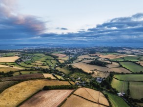 Sunset of Fields and Farms over Devon from a drone, Torquay, Torbay, Devon, England, United Kingdom