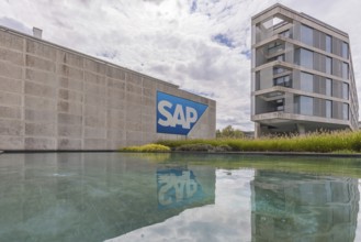 Logo and building of the software company SAP SE. Walldorf, Baden-Württemberg, Germany
