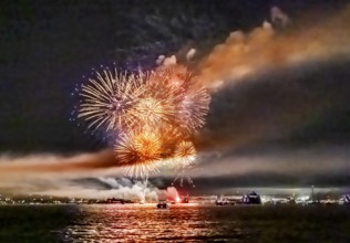 Lake Night Festival Constance. Water fireworks over the German shore and the neighbouring Swiss