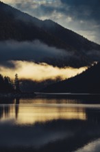 Sunrise with reflections in Lake Heiterwanger See in Tyrol in the Alps in Austria