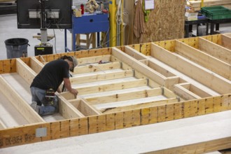 Romulus, Michigan - Workers build apartments in Ginosko Modular 's factory using modular