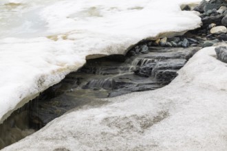 Melting glacier, stones, water, Cooper Camp, Spitsbergen, Svalbard