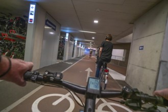 Ride your bike into and out of the bicycle car park at Utrecht Centraal station, Stationsplein,