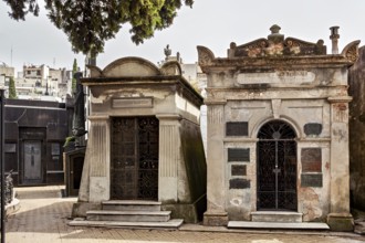 Two adjoining tombs in a cemetery with decorative elements, La Recoleta Cemetery in Buenos Aires