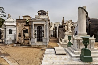 Row of marble monuments and columns in a historic cemetery, La Recoleta Cemetery in Buenos Aires