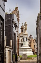 Burial site next to church and dome, architecture in sacred style, La Recoleta cemetery in Buenos
